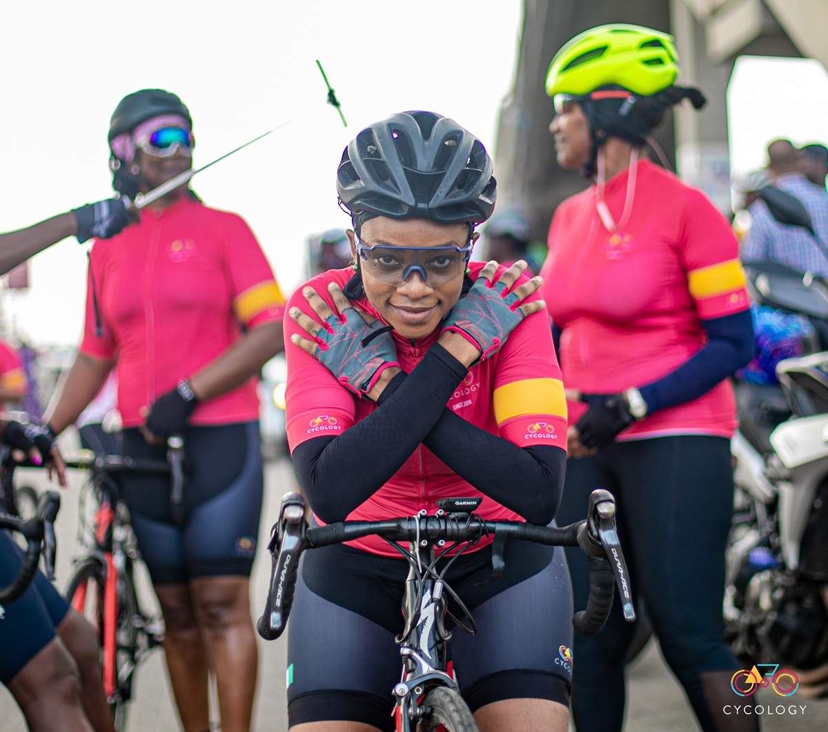 Cycology riders together in their pink club kit